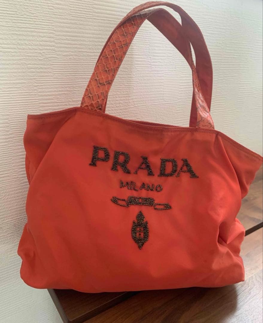 PRADA ビーズ　オレンジ トートバッグ PRADA（プラダ）トートバッグ オレンジ サイズ:- レディース